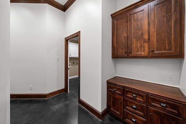 carpeted empty room with ceiling fan, a raised ceiling, and ornamental molding