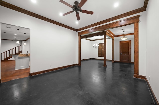 interior space with ceiling fan with notable chandelier and ornamental molding