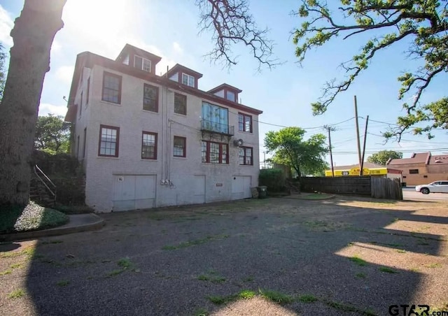 back of property with fence
