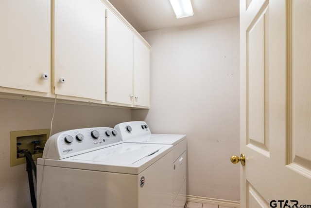 laundry area with cabinets and washer and dryer