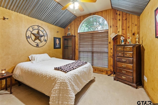 carpeted bedroom featuring lofted ceiling and ceiling fan