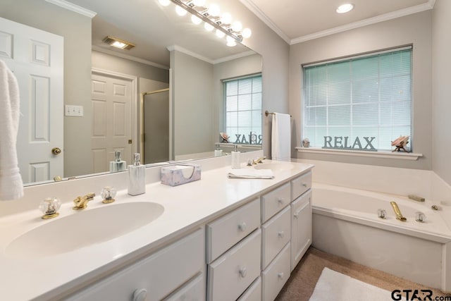 bathroom featuring vanity, ornamental molding, and separate shower and tub