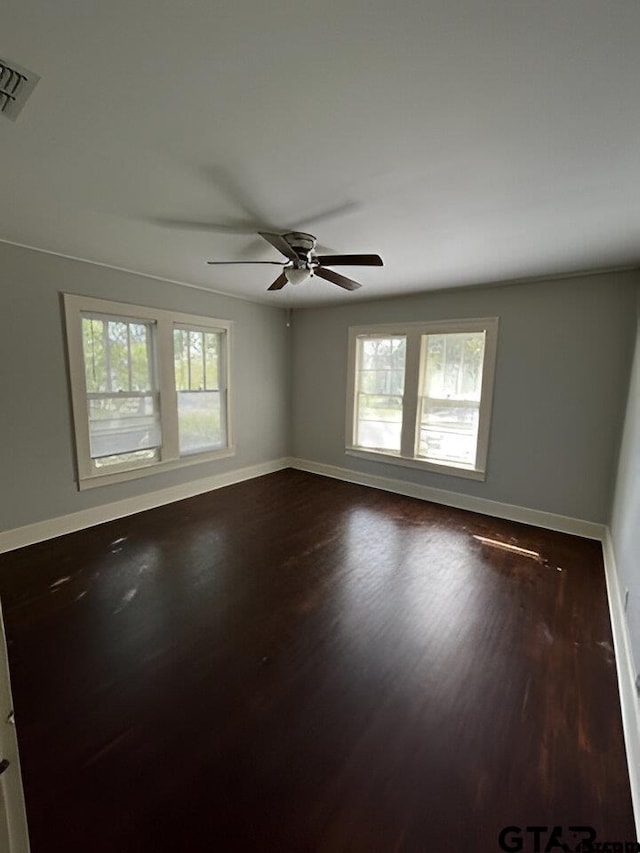 spare room featuring ceiling fan and hardwood / wood-style floors