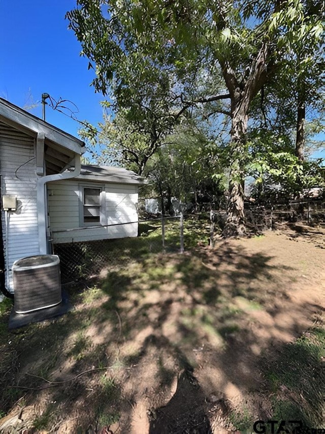 view of yard featuring central air condition unit