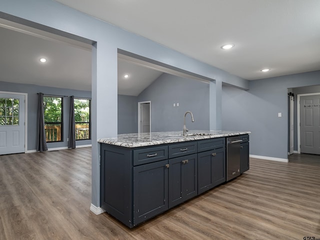 17795 Lookout Ln, Flint, TX 75762 - kitchen featuring stainless steel dishwasher, lofted ceiling, a sink, and wood finished floors