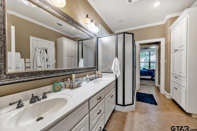 bathroom with vanity, tile patterned floors, an enclosed shower, and crown molding