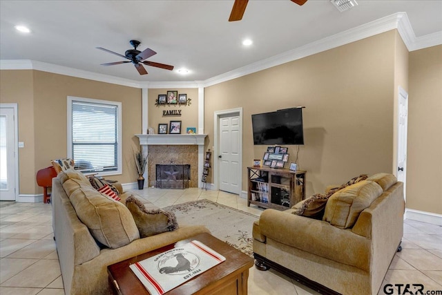 tiled living room with ceiling fan and ornamental molding