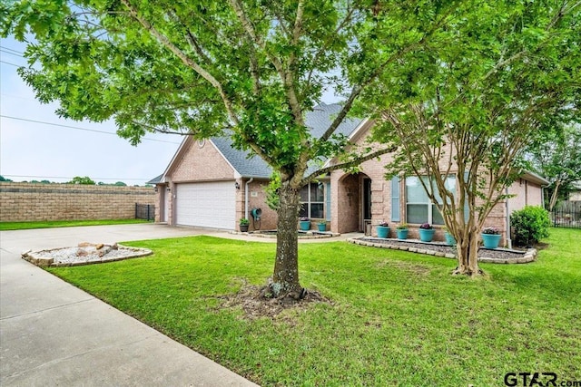 view of front of property featuring a front lawn and a garage