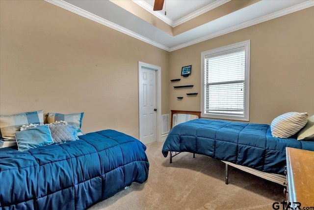 bedroom with carpet floors, crown molding, and ceiling fan