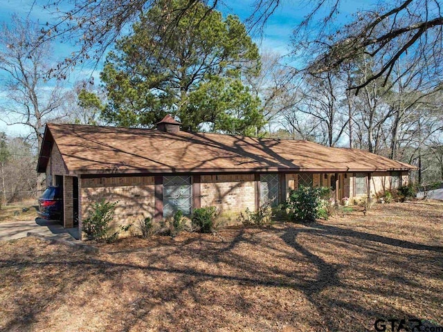564 County Road 1100, Daingerfield, TX 75638 - view of front of home featuring a chimney and brick siding