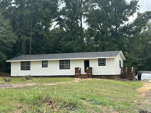 view of front of home with a front lawn