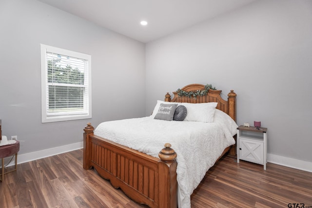 bedroom featuring dark hardwood / wood-style floors