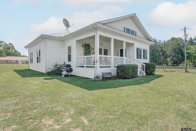 view of front facade with a porch and a front lawn