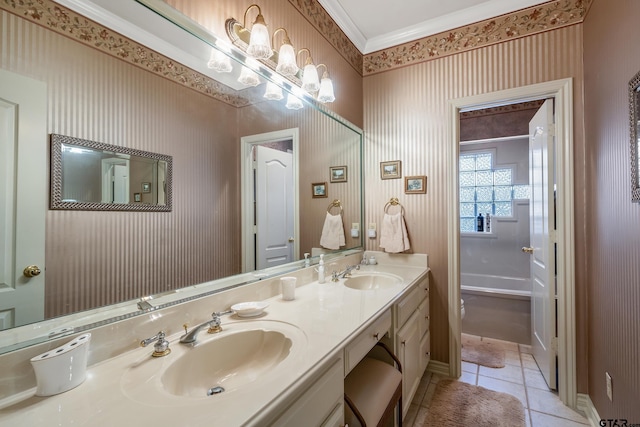 bathroom featuring tile patterned flooring, vanity, and crown molding