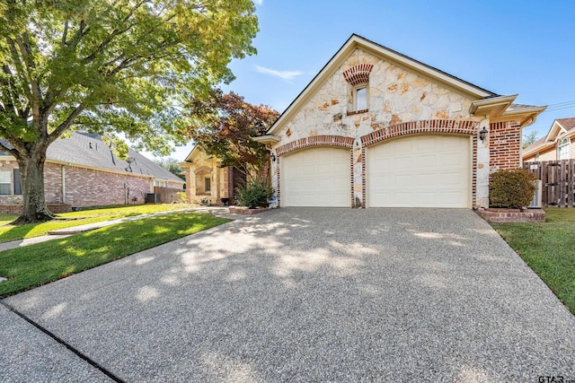 view of front of house with a front lawn and a garage