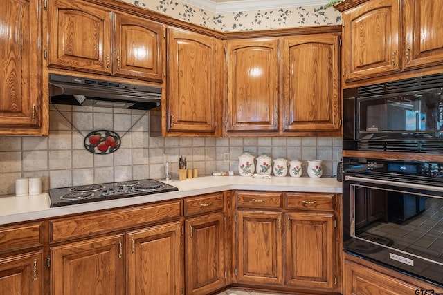 kitchen with electric cooktop, black microwave, tasteful backsplash, and crown molding