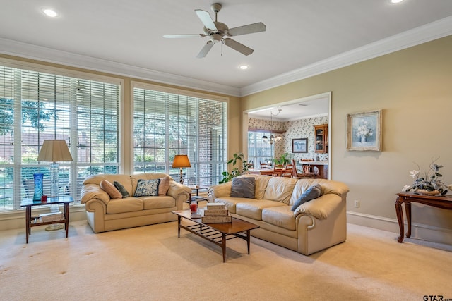 carpeted living room featuring a wealth of natural light, ceiling fan, and crown molding