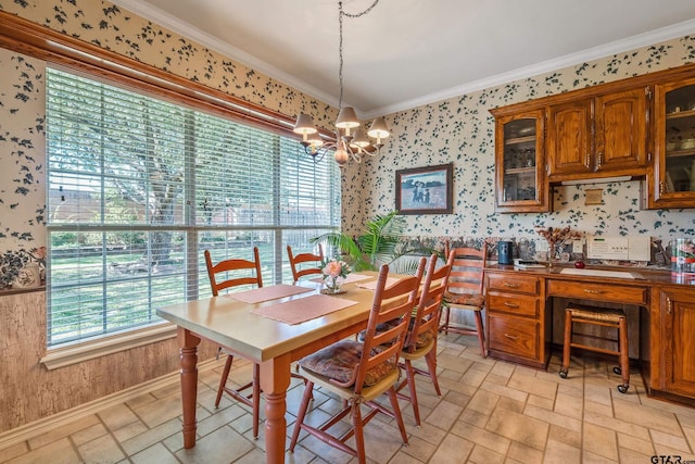 dining room with a notable chandelier and ornamental molding