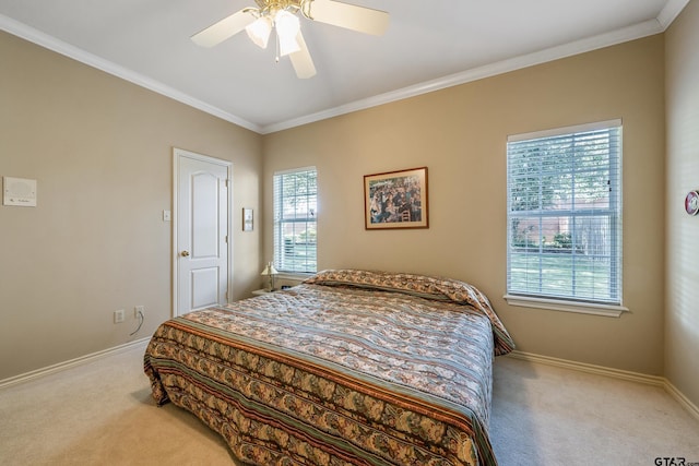 bedroom featuring light colored carpet, multiple windows, and ceiling fan