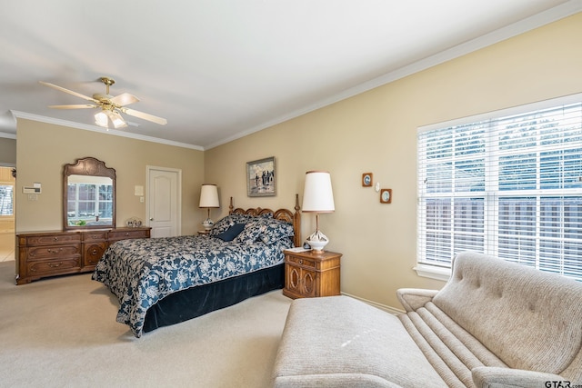 carpeted bedroom featuring ornamental molding, multiple windows, and ceiling fan