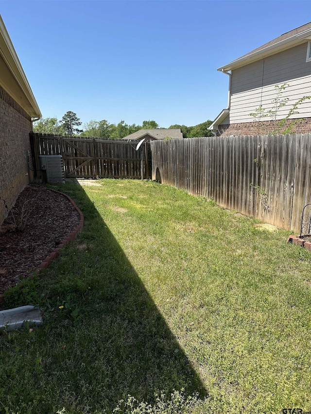 view of yard featuring a fenced backyard and cooling unit