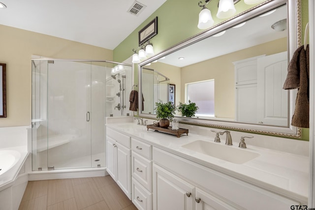 265 Bunker Dr, Tyler, TX 75703 - full bath with double vanity, a shower stall, and a bath
