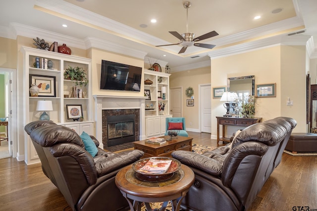 265 Bunker Dr, Tyler, TX 75703 - living room with ceiling fan, a premium fireplace, wood finished floors, ornamental molding, and recessed lighting