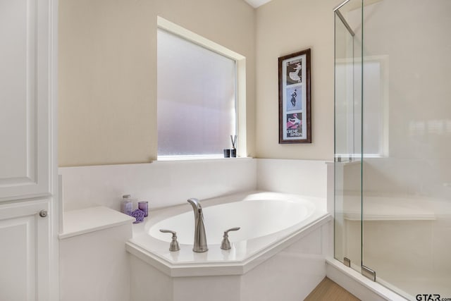 265 Bunker Dr, Tyler, TX 75703 - bathroom featuring a bath and a stall shower
