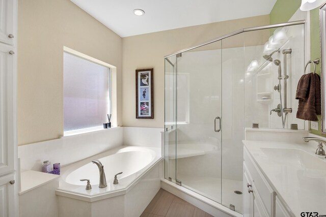 265 Bunker Dr, Tyler, TX 75703 - full bath featuring a stall shower, a garden tub, and vanity