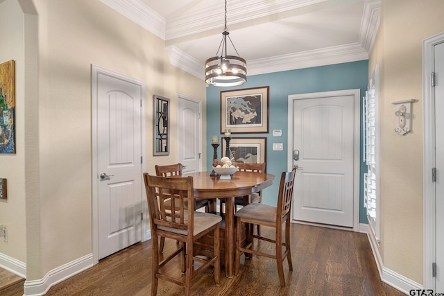 265 Bunker Dr, Tyler, TX 75703 - dining room with a chandelier, dark wood-type flooring, and ornamental molding