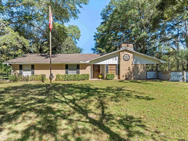 single story home with a front lawn