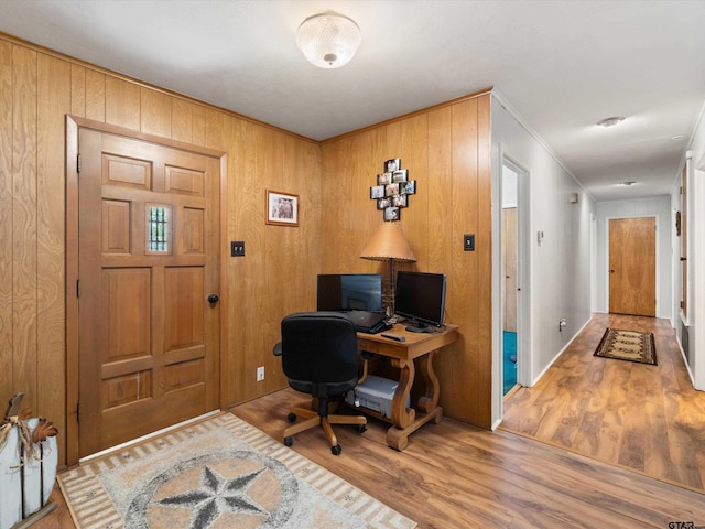 office with hardwood / wood-style floors and wooden walls