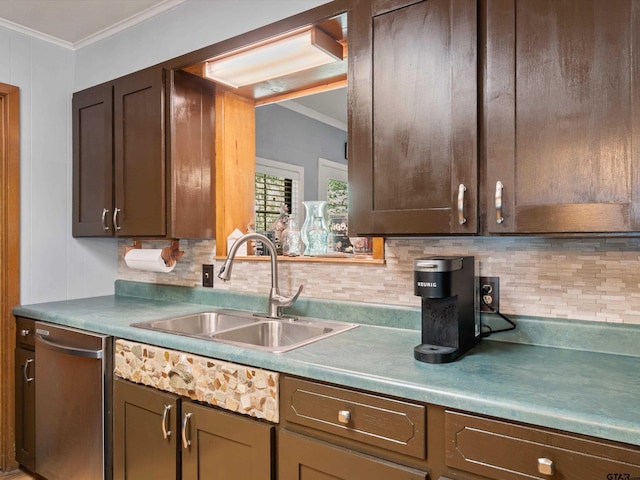 kitchen with crown molding, sink, and backsplash