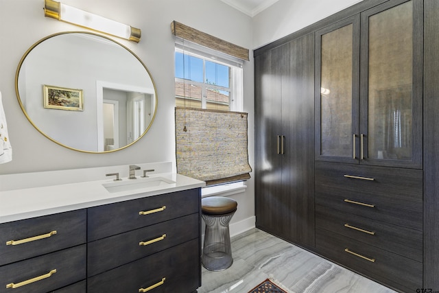 bathroom featuring vanity and ornamental molding