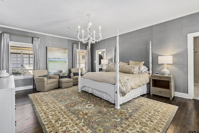 bedroom with dark hardwood / wood-style floors, crown molding, and an inviting chandelier