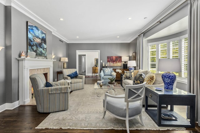 living room with dark hardwood / wood-style flooring and crown molding