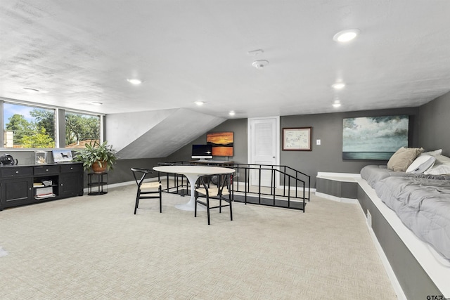 recreation room with light colored carpet and lofted ceiling