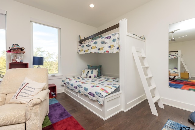 bedroom with dark hardwood / wood-style flooring