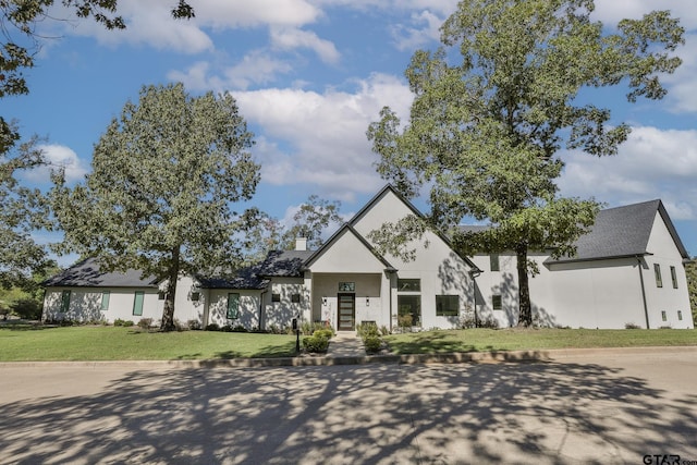 view of front of property with a front lawn