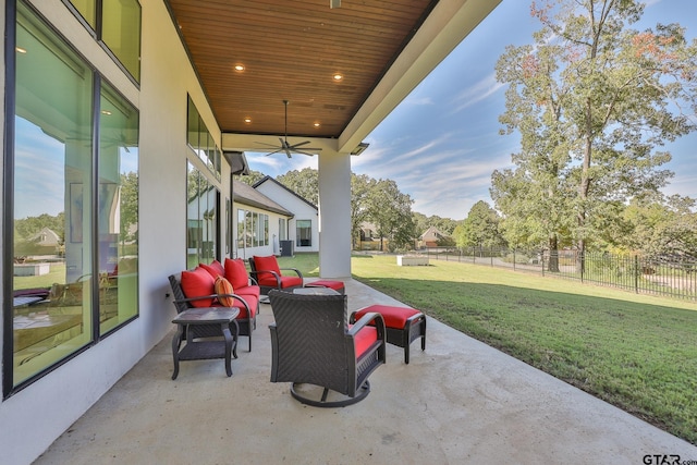 view of patio with outdoor lounge area and ceiling fan