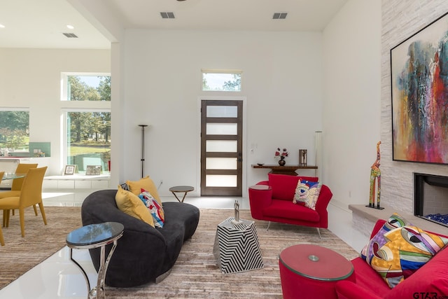 living room featuring a towering ceiling