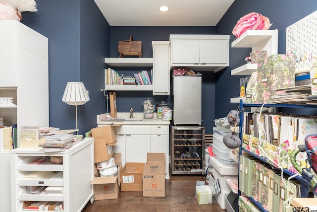 interior space with beverage cooler and sink