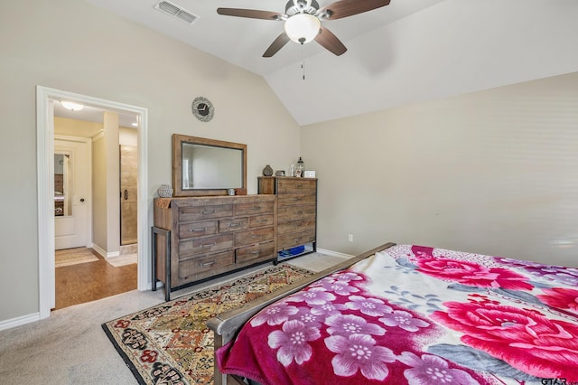 bedroom featuring ceiling fan, light colored carpet, and vaulted ceiling