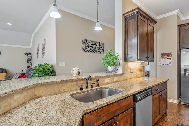 kitchen with light stone countertops, appliances with stainless steel finishes, hanging light fixtures, and sink