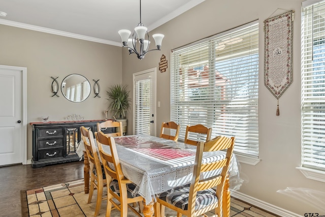 dining room featuring a chandelier and crown molding