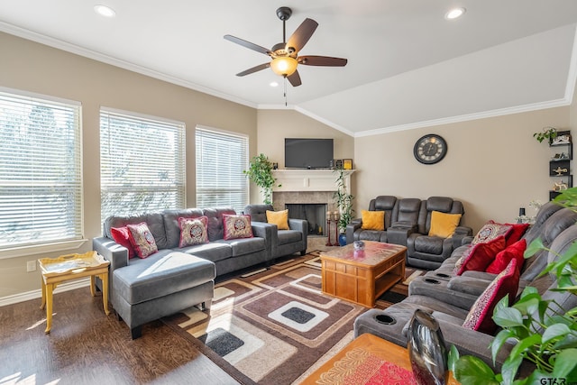 living room with ceiling fan, dark hardwood / wood-style flooring, crown molding, and vaulted ceiling