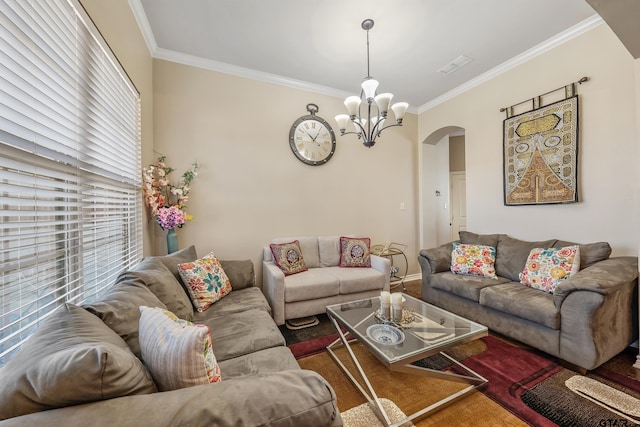 living room featuring ornamental molding and a chandelier