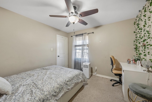 bedroom featuring ceiling fan and light colored carpet