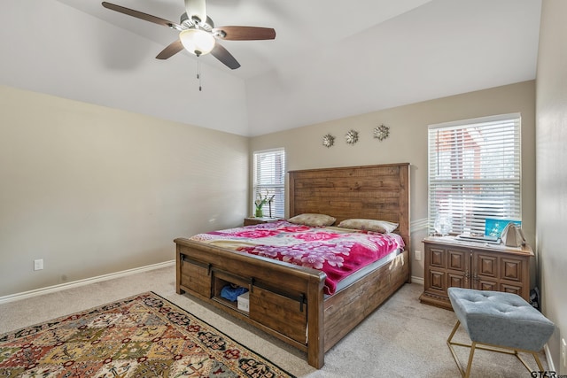 bedroom with multiple windows, light colored carpet, and ceiling fan