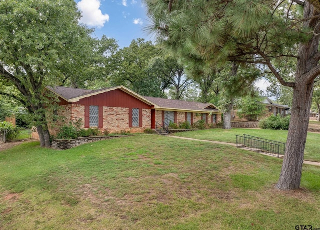 ranch-style house with a front lawn